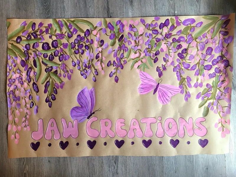 JAW Creations banner with purple wisteria and butterflies