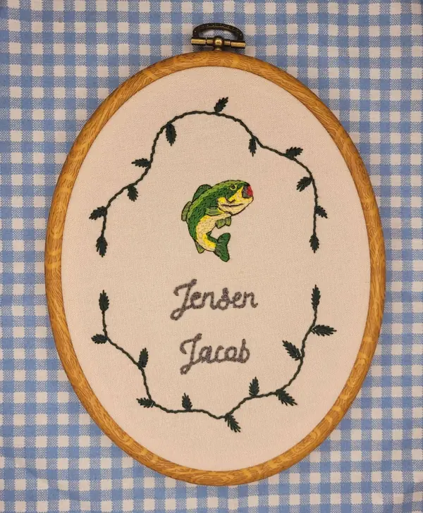 Embroidery hoop with a fish and the name Jensen Jacob