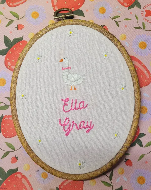 Embroidery hoop with a goose and the name Ella Gray