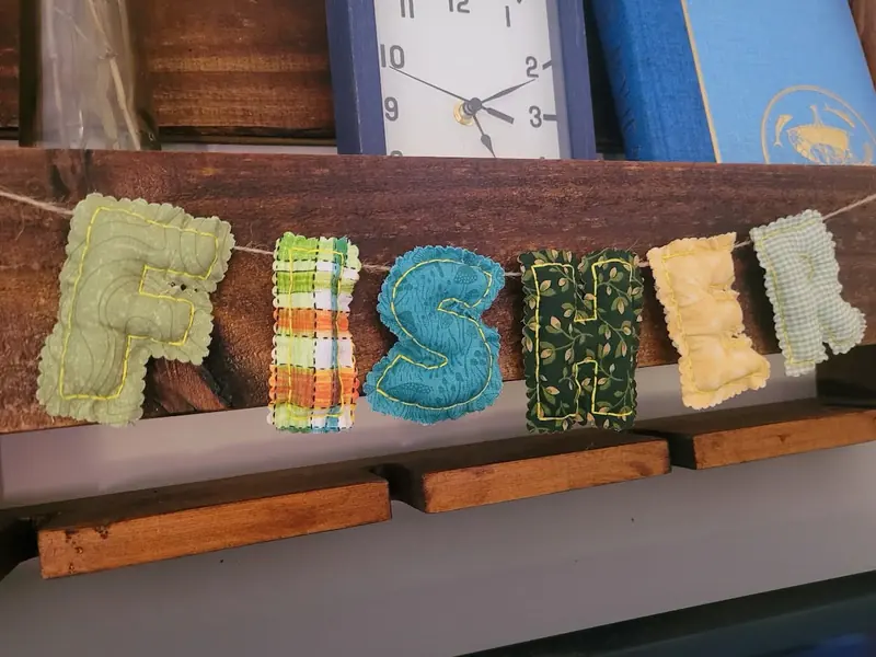 Rustic fabric letter banner spelling Fisher
