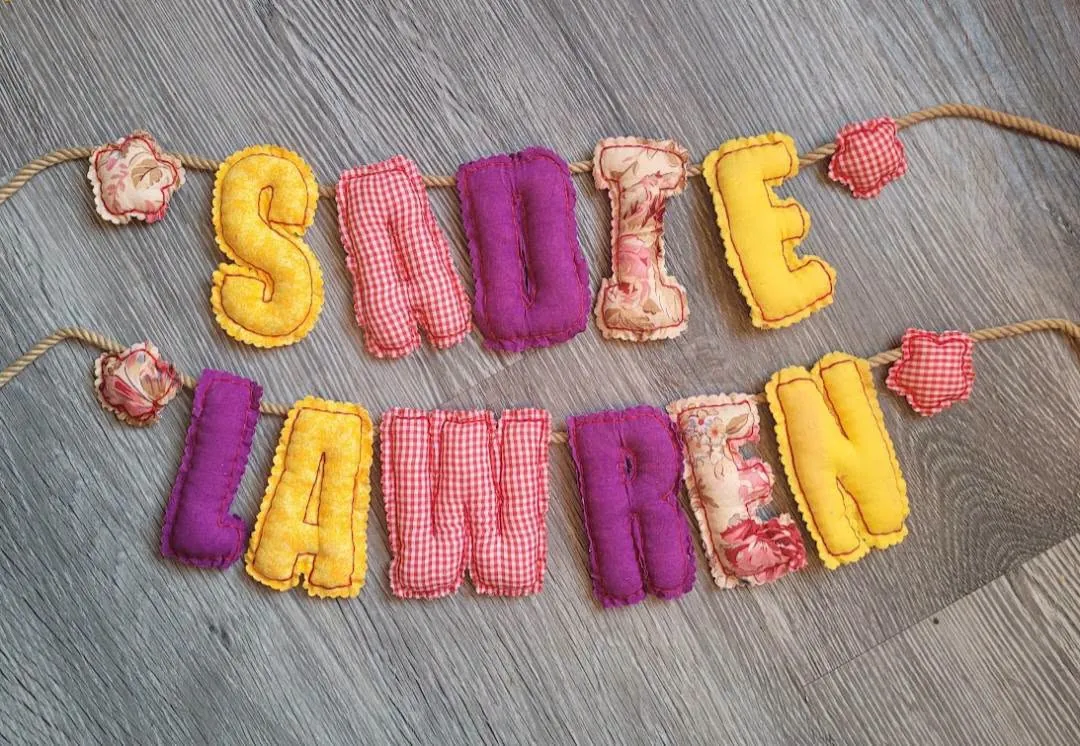 Plush fabric name banner spelling Sadie Lawren