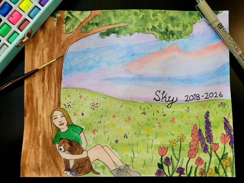 Memorial watercolor of a girl and her dog beneath a tree in a wildflower field